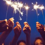 women holding sparklers