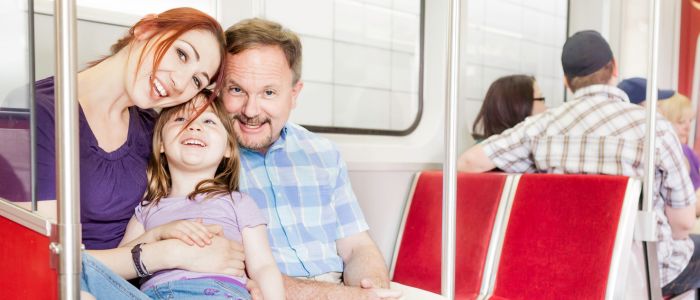 fh-inblog-public-transit-family family traveling via public transit