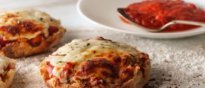 fh-inblog-english-muffin-pizzas Try cheap meal ideas like English muffin pizzas baked crisp with marinara and melted mozzarella on top.
