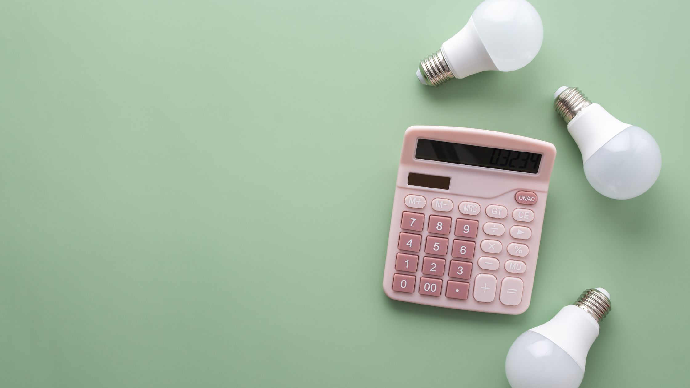 three led bulbs next to a pink calculator